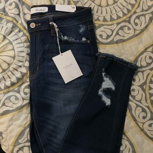KanCan distressed skinny jeans.